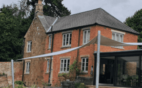 Sail Shades for Christmas: Beautiful period house with large sail shade in garden